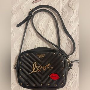Black Victoria Secret cross body purse.